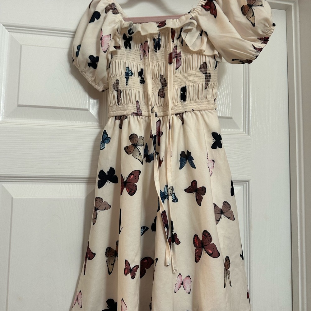 Ivy City Co mini Rae Cream Butterfly Smocked Dress with Multi-Color Print